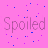 A static image with a pink background featuring scattered blue and purple dots, text reading "Spoiled And Loving it!", and an inset of stacked money bundles on the right side.