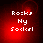 Red background with white pixelated text 'Rocks My Socks!' in four quadrants, each showing identical static content.