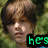 A pixelated image of a person with brown hair against green foliage, featuring text overlays in different colors across three views.