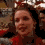 A person in a red top with dark hair appears in three pixelated frames showing slight head movement and expression changes against a blurred background.