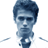 Pixelated blue-toned static icon of a person's head and shoulders with dark hair, white shirt collar, and tie against transparent background.