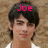 Two side-by-side pixelated images of a person with dark hair and white clothing, each labeled with pink text above the head.