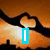 Animated sequence showing text changing from 'I' to 'Love' to 'You' over a sunset background with two hands forming a heart shape.
