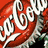 Three distinct beverage can labels displayed in a with red Coca-Cola, blue Sprite, and green 7UP logos