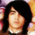 A person with long dark hair and a white-collared shirt appears in three showing subtle facial expression changes