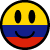 Static pixel art smiley face with yellow upper half, blue middle stripe, and red lower stripe; black oval eyes and curved mouth on a gray background.