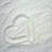 A static pixelated image with a light gray background and faint, indistinct shapes resembling abstract forms or blurred outlines.