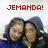 Two people in blue hoodies pose together under red pixelated text reading JEMANDA! We're so greater than everything.
