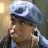A 48x48 pixel animated buddy icon featuring a side-profile of a person wearing a light blue beret and denim jacket, with the word "honey" in stylized blue text on a dark background to the right.