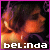 Pixelated image with orange and purple hues showing a figure's face against dark background, bordered by solid pink frame.