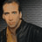 Static 48x48 pixel icon showing a person with short hair wearing dark clothing against a gradient background, rendered in low-resolution pixel art style.