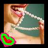 A close-up of a person's mouth and chest holding a white beaded necklace, with a green and pink heart-shaped graphic overlay in the bottom-left corner.