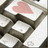 Pixelated keyboard with a heart key and pink text about conversations repeating on keyboards.