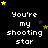 Black background with white pixelated text You're my shooting star repeated in a , surrounded by yellow and brown stars
