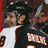Pixelated image of a person in sports attire with orange background and text #48 Danny Briere.