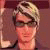 Pixelated static image of a person with light-colored hair, dark sunglasses, and a neutral expression against a muted background.