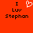 Red background with black text reading "I Luv Stephan" and a white pixelated heart symbol above the word "Luv".