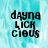 Pixelated text 'dayna LICK cious' on a light blue and white abstract background with visible motion blur effects.