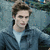 A pixelated static image shows a person with short brown hair wearing a dark jacket over a light shirt against a blurred blue-green background.