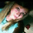 Pixelated image of a person with long hair and light blue clothing on the left, next to bright green pixelated text reading "hey there bestfriend :)<3!" on white background.