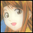 A pixelated anime-style character face with brown hair and large eyes on the left, next to a black background with white text reading "Anime IM" above smaller text "COM" on the right.