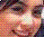 Pixelated close-up of a person's face with dark hair, pinkish skin tones, and visible eyes under low-resolution rendering.