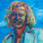 Pixelated static image of a person with light-colored hair against a blue background, rendered in low-resolution mosaic style with visible dithering and color blending.