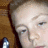 A pixelated close-up of a person's face with closed eyes, showing two states: one without text and another with pink 'peace' text above the head.
