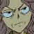 Pixelated close-up of a pale-skinned face with light blue eyes, dark eyebrows, and a neutral expression against a muted brown background.