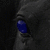 six shows a dark figure's eye changing color from blue to green, with text elements in bright green and blue on solid backgrounds