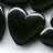 Black heart-shaped object with white outline on metallic surface, paired with pixelated text blocks reading "my heart is black because", "I will never see u again", and "MISS U CODY<3".