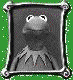 Four identical framed images of a gray frog-like character with green eyes and a white collar against a dark background, set on a green