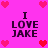 Pixelated pink background with four identical text blocks reading "I LOVE JAKE" surrounded by red and pink heart icons.