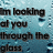 Pixelated text reads "I'm looking at you through the glass" over a blue-toned pixelated background.