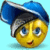Static pixelated icon of a yellow cartoon face with blue eyes wearing a blue and black hat against a light blue background.