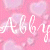 Pink background with light pink hearts, two overlapping cursive text elements reading 'Alby' in white and purple.