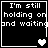 Four black-and-white pixel art display the text "I'm still holding on and waiting" with varying heart symbols below