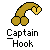 Pixelated golden object resembling a curved hook with two rounded ends and a heart-shaped tip, positioned above text reading "Captain Hook" on a gray background.