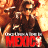 A pixelated image shows a figure in dark clothing holding a weapon, with a red banner displaying 'HEIS' below.