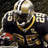 Pixelated image of a football player in a dark uniform with gold accents, wearing a helmet and holding a football, viewed from a low angle.