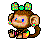 Pixelated monkey with brown fur, blue eyes, and a colorful checkered bow on its head, holding an orange fruit-like object.