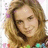 Pixelated image of a person with light brown hair and a colorful top, surrounded by text reading She Is Sexy!! Hot!! Fine!! Beautiful!! ALL Mine!!