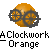 Pixelated orange sphere with dark gray mechanical gear overlays, set against light gray background; text below reads 'A Clockwork Orange' in blocky pixel font.