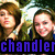 Two people in a pixelated image with green foliage background and blue text reading 'chandler' at bottom.