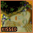 A pixelated image of a couple kissing under a tree with the word KISSED in orange text below.