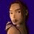 A pixelated buddy icon featuring a character with brown hair against a blue background on the left, and green text reading "Original Icons .com" on a dark green background on the right.