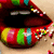 Colorful lips with striped patterns and sprinkles, showing mouth opening and closing animation.