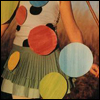 A static image of a stylized figure with a polka-dot dress, long brown hair, and a light blue circular accessory on the right side.