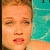 Pixelated static icon showing a close-up of a person's face with closed eyes and parted lips against a teal background.