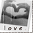 A grayscale buddy icon shows a stylized heart shape with a small white dot inside, positioned above the word 'love' in lowercase letters.